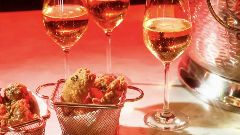 Bubbles & Bites - Champagne & Fried Chicken on Virgin Voyages cruise ships
